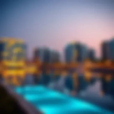 Evening view of Emaar Lagoons with illuminated buildings reflecting in the water